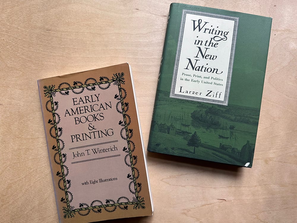 two book covers on a wood table