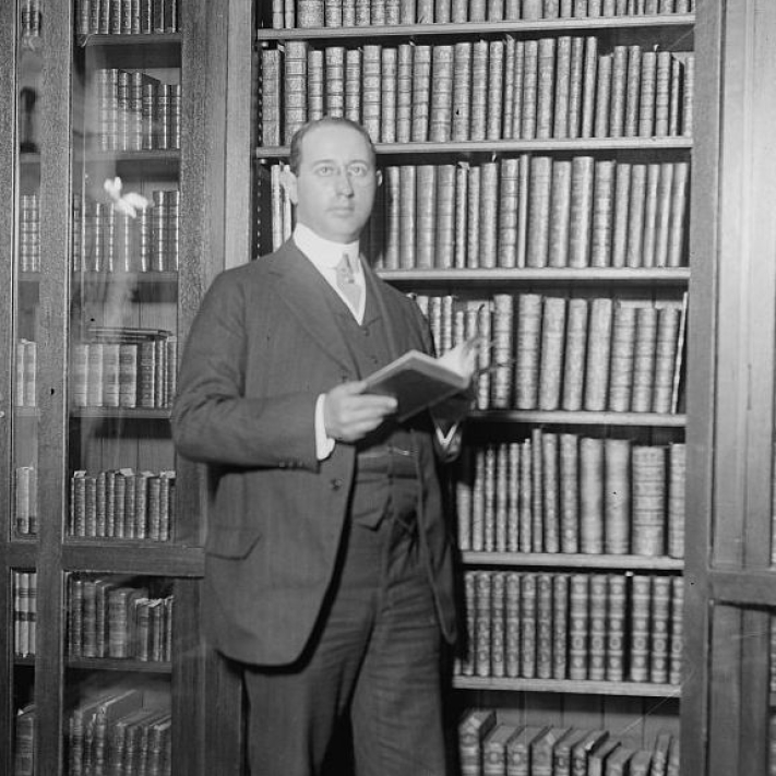 rosenbach in front of a bookcase